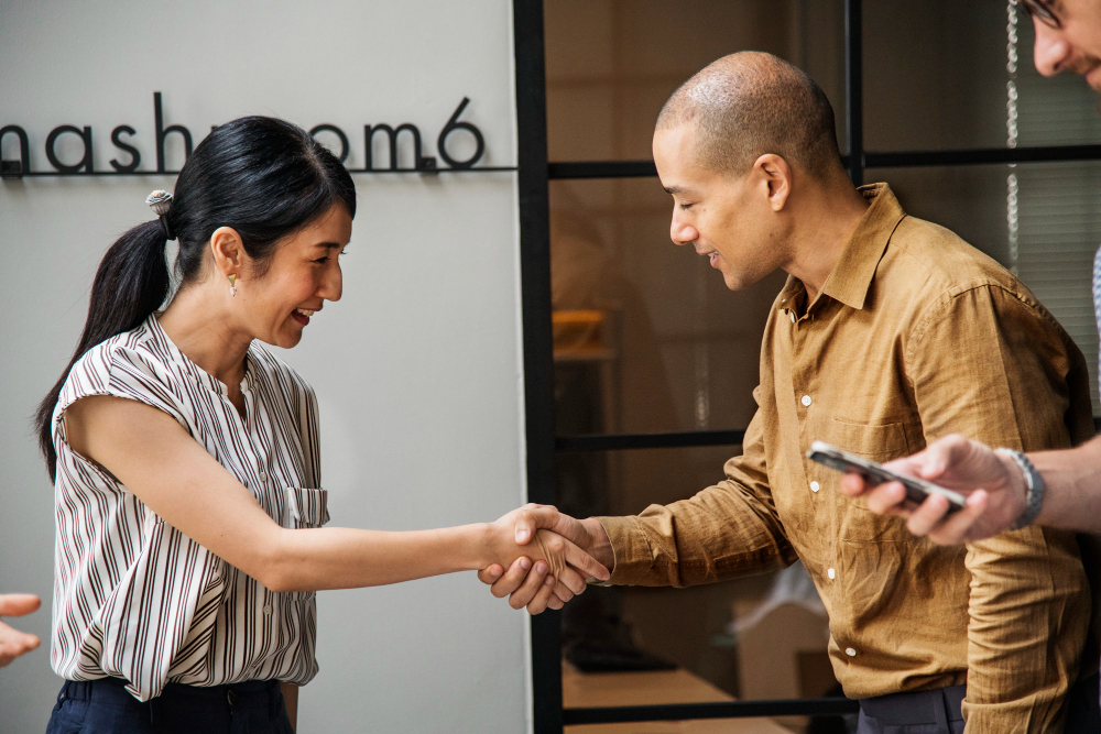 Business handshake showing what customer centricity is through trust.