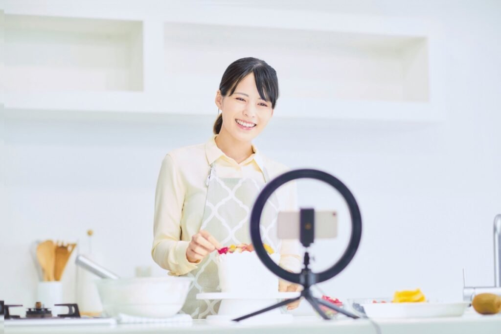 A woman baking a cake while livestreaming
