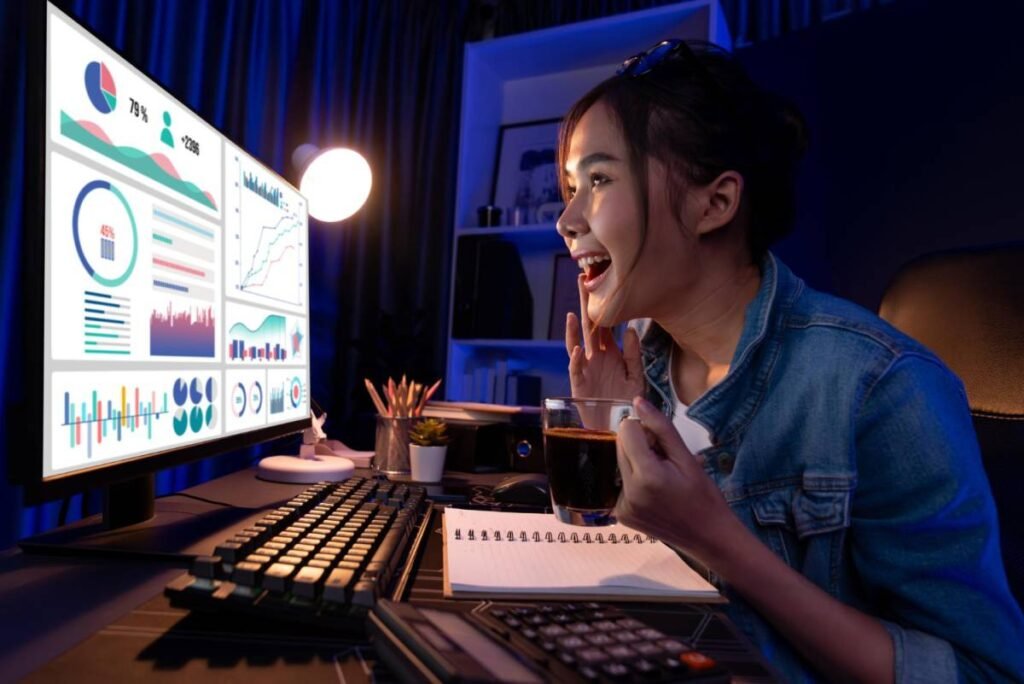 A Young woman analyzing viral marketing data on a computer