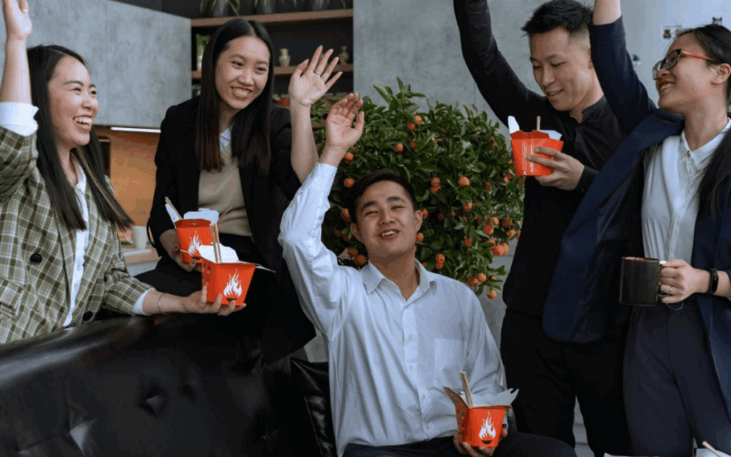 Chinese colleagues celebrating workplace leadership
